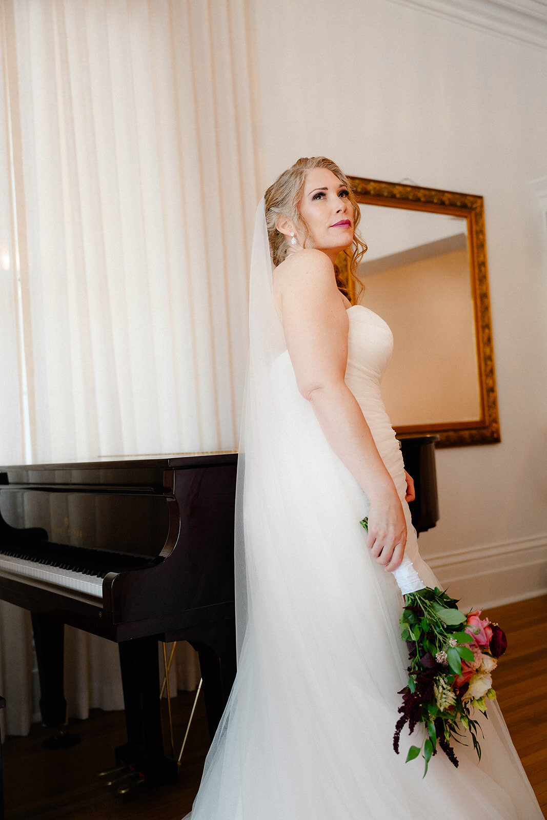 Bridal gown detail by the piano